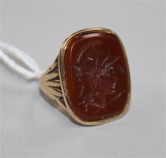 A Georgian gold and carnelian intaglio ring (cracked), size F.
